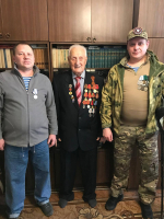 Участники СВО поздравили гатчинских ветеранов с Днем защитника Отечества